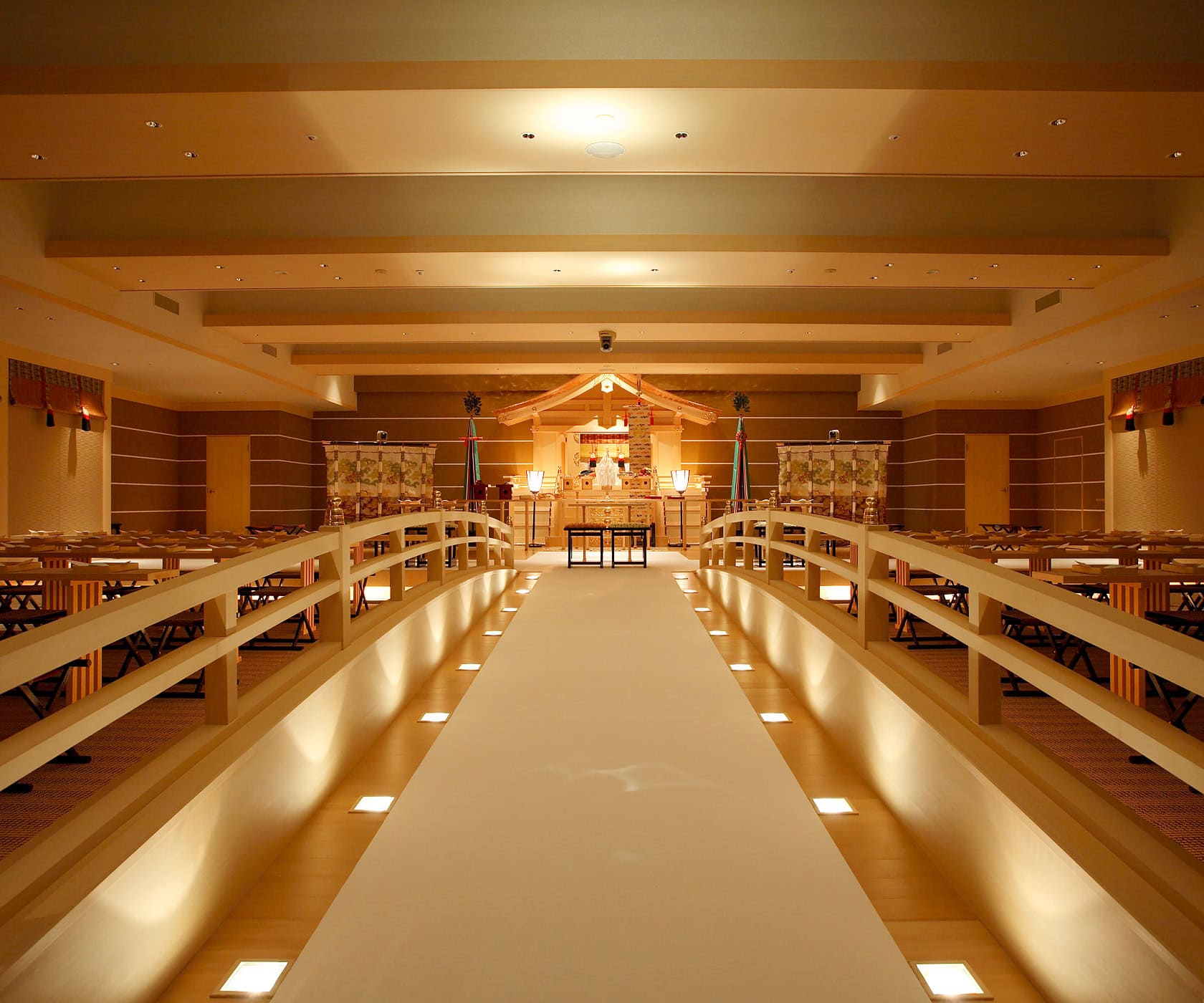 A traditional Shinto wedding altar and a solemn reception hall.